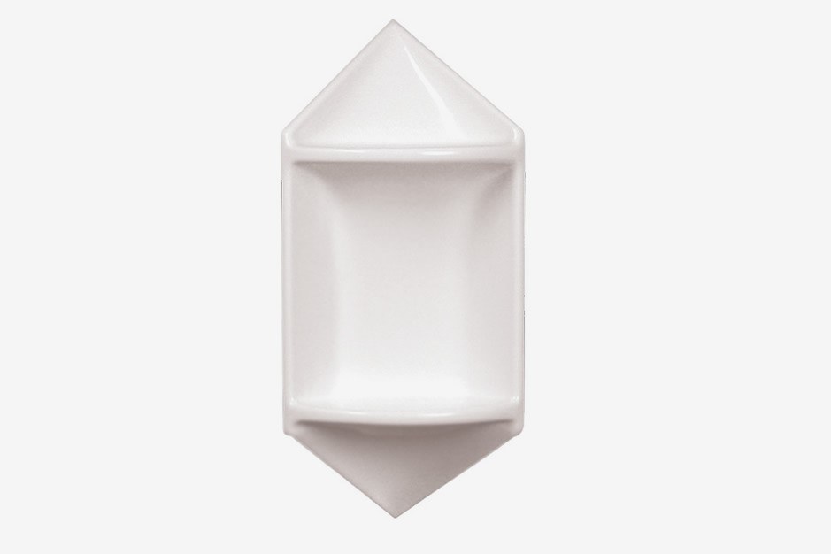A white, geometric ceramic dish with two triangular ends and a rectangular center, photographed on a plain white background.