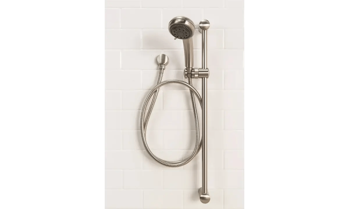 Wall-mounted showerhead with a flexible hose and sliding bar, set against a white tiled background. Modern, sleek design.