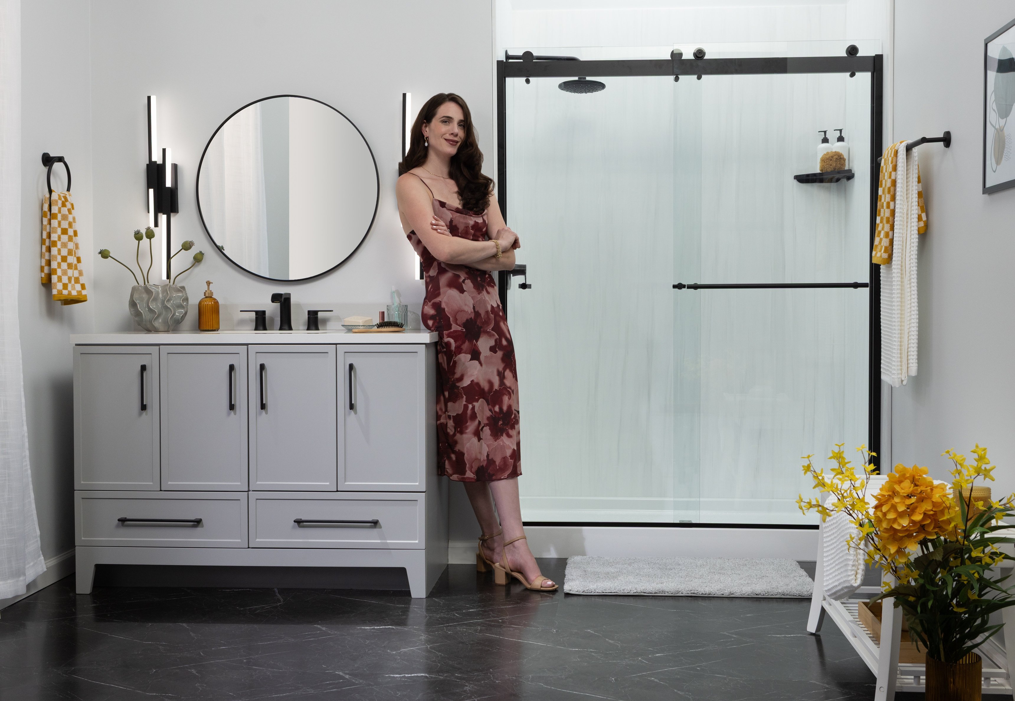 Low-maintenance walk-in shower with practical storage and glass doors