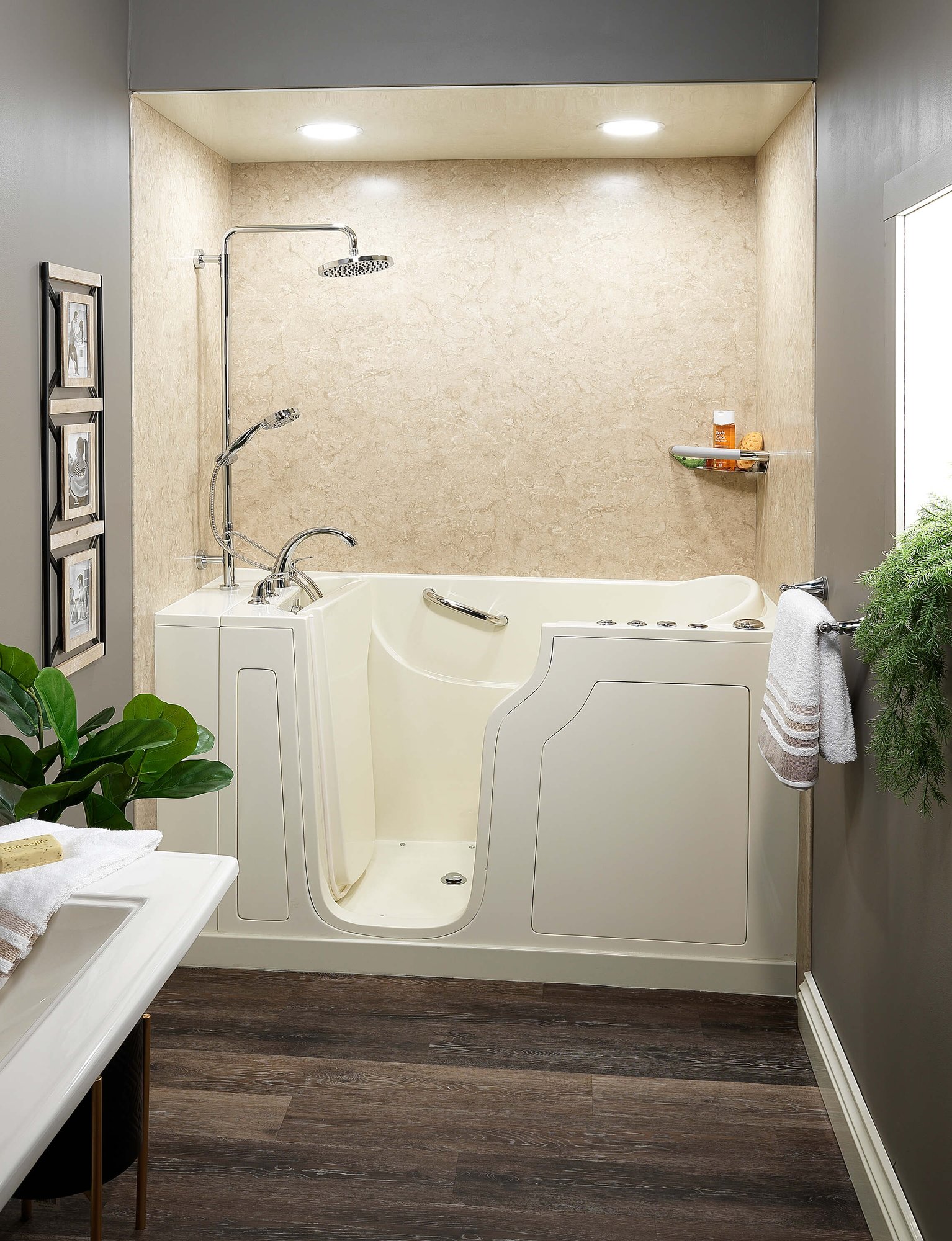 Sierra walk-in shower with textured walls, chrome fixtures, a grab bar, and a built-in seat.