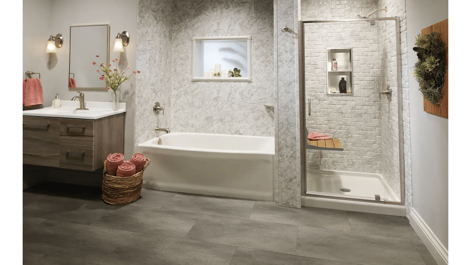 Bathroom interior featuring a bathtub, walk-in shower with built-in bench and shelves, a gray vanity with a white countertop, and light gray marble-patterned walls.